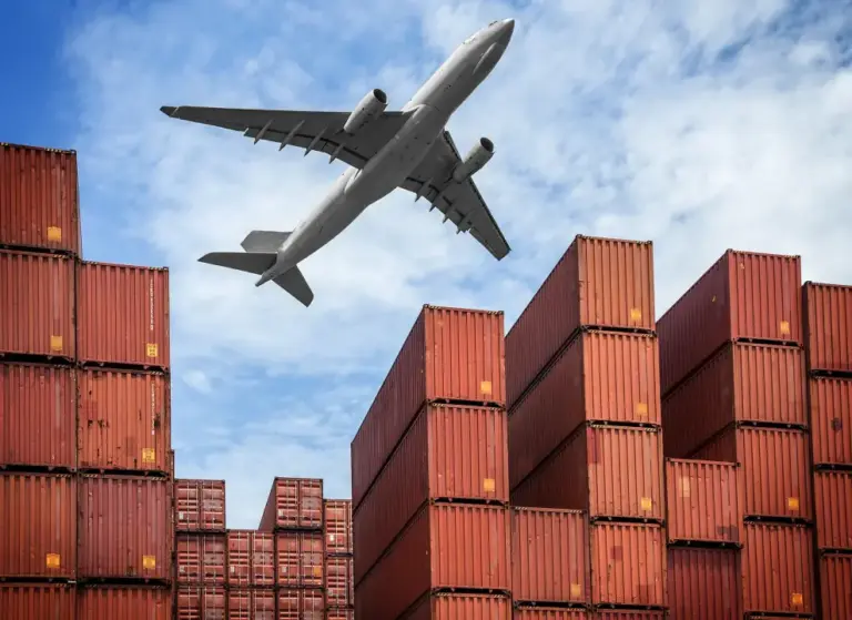 air-freight-cargo-plane-flying-stack-containers-container-port