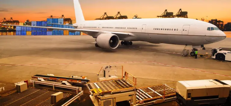 Cargo airplane landing on runway at sunset representing fast and secure international air freight Services by Tawam Al Shahin Transport