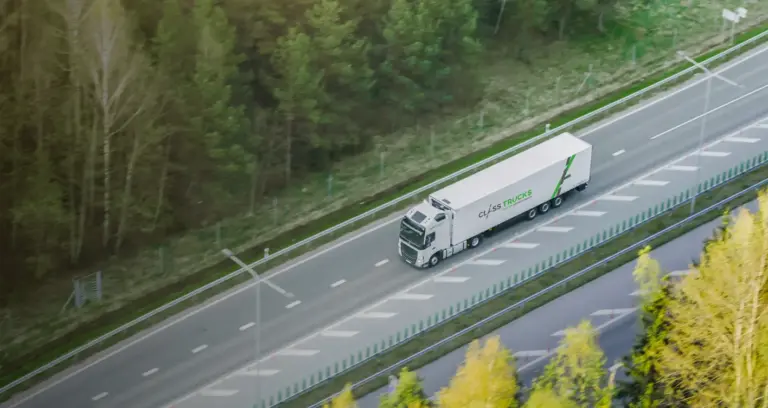 Long-haul freight truck driving on highway representing road transport and logistics Services by Tawam Al Shahin Transport in UAE and GCC