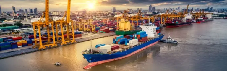 Roll-on roll-off ship loading vehicles at a European port, representing professional car shipping services from Dubai to Europe.